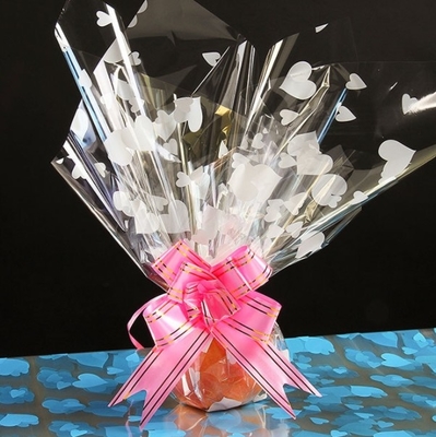 Un bon prix. Papier imprimé en cellophane en forme de cœur, papier à pommes, papier d'emballage de fleurs, de fruits et de fruits de Noël, articles de bricolage pour la veille de Noël et Noël en ligne