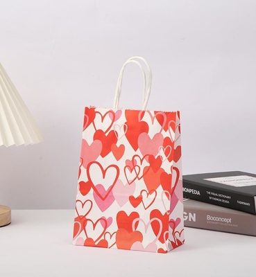 Un bon prix. Le cadeau rouge de papier de 80gsm emballage met en sac le papier imprimé par coeur Goodie d'amour met en sac avec des poignées en ligne
